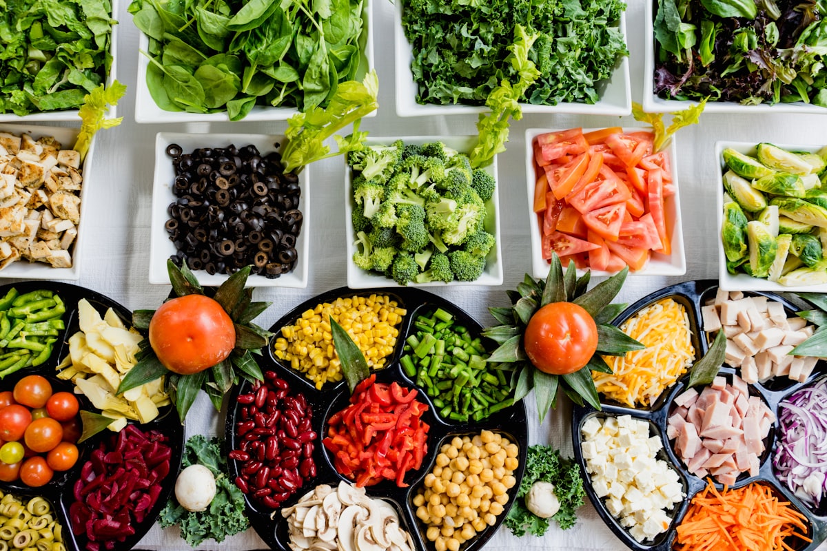 Colorful fresh vegetables and whole grains arranged on a kitchen counter