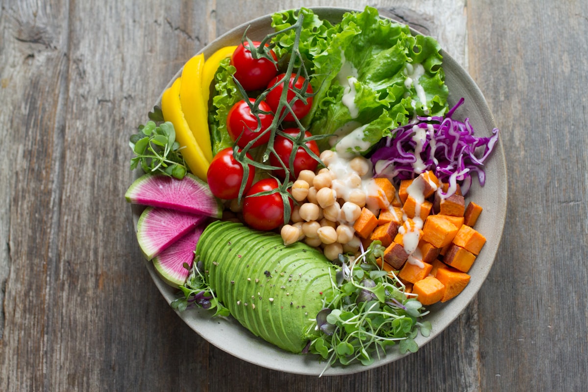 A balanced plate of vegetables, protein, and grain arranged in eating order