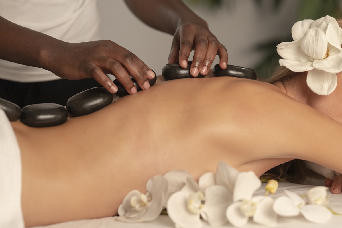 A therapist examining and mobilizing a patient's joint
